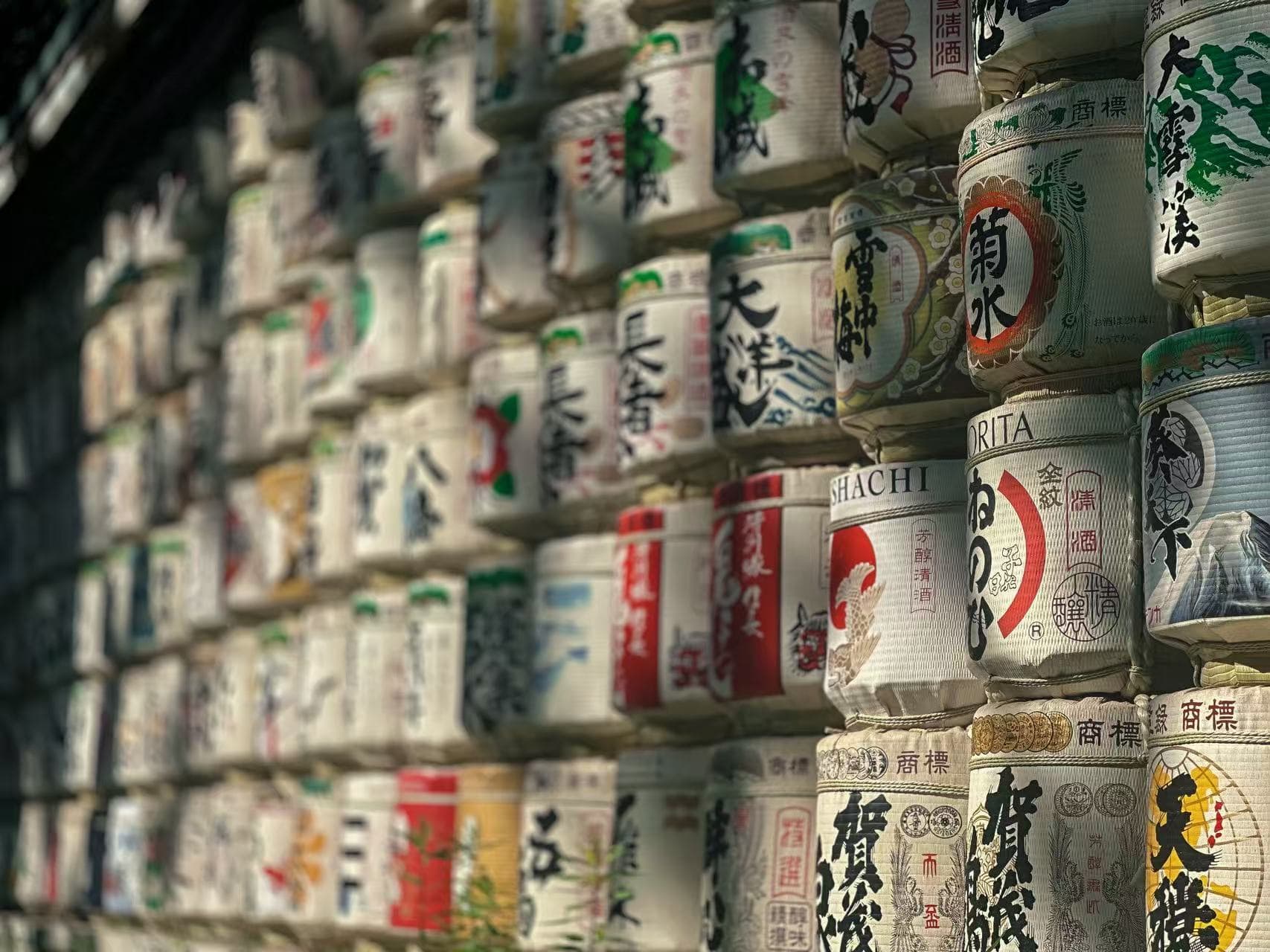 Wall of decorated sake barrels